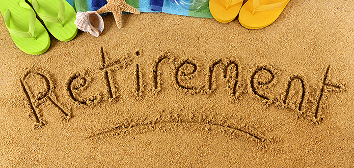 The word Retirement written in beach sand